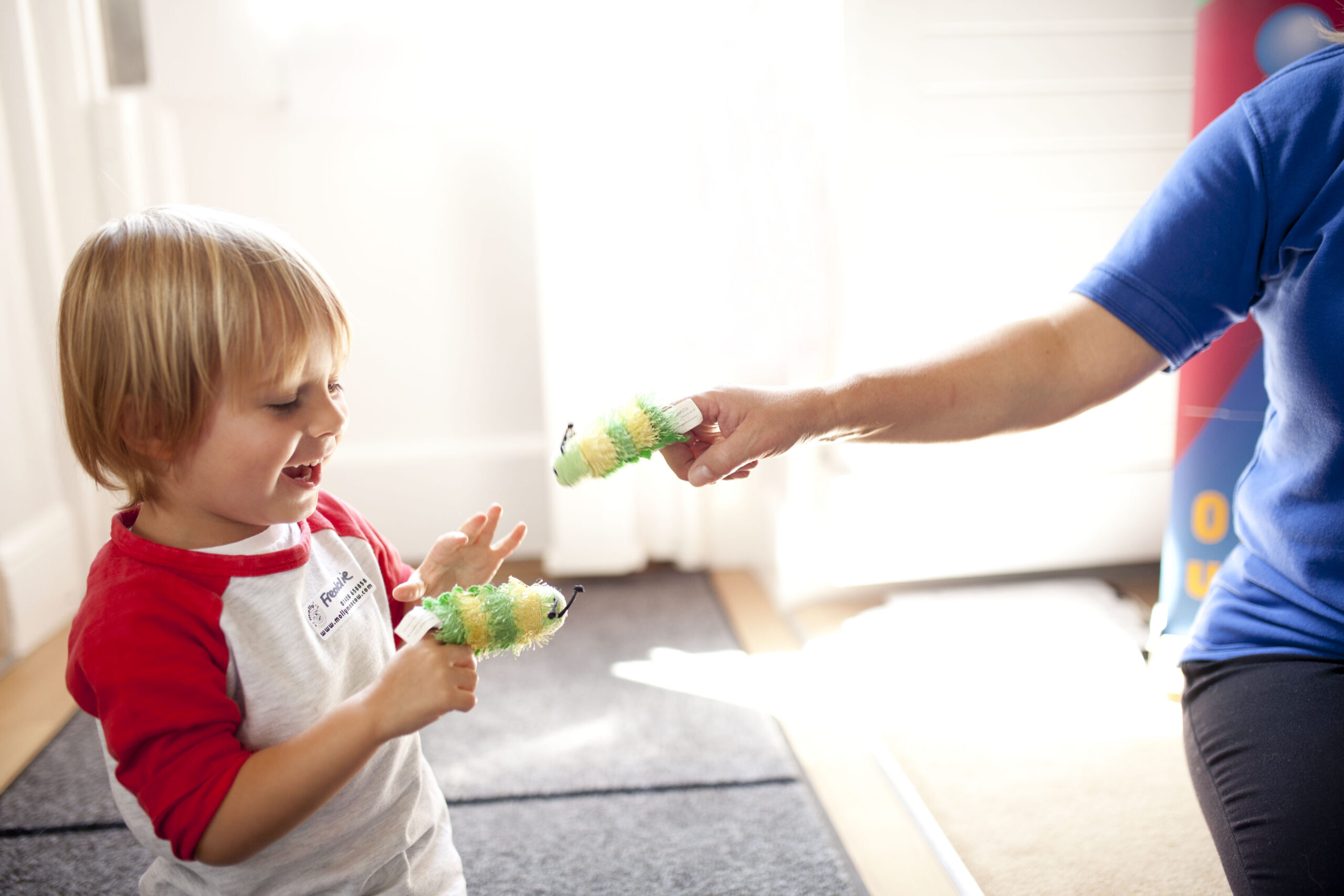 Caterpillar puppets in a Molly Moocow class